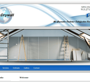 Interior drywall installation with scaffolding and ladders in a construction site.