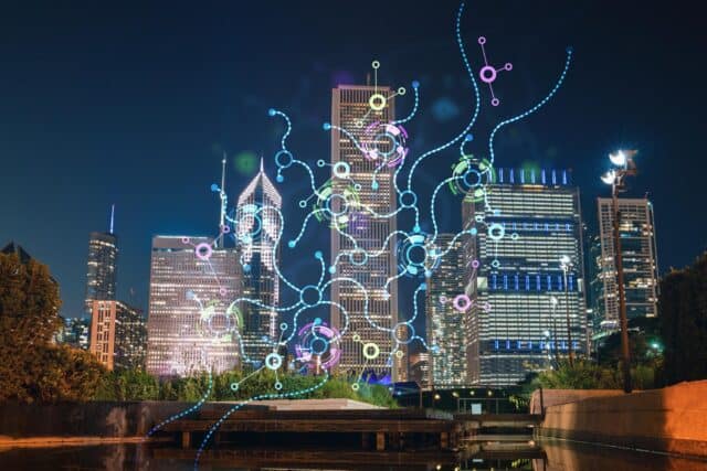 Futuristic cityscape featuring illuminated skyscrapers and digital data streams at night.