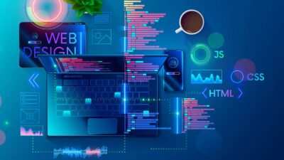 Modern web design workspace with coding, laptop, and coffee for Kansas City business websites.
